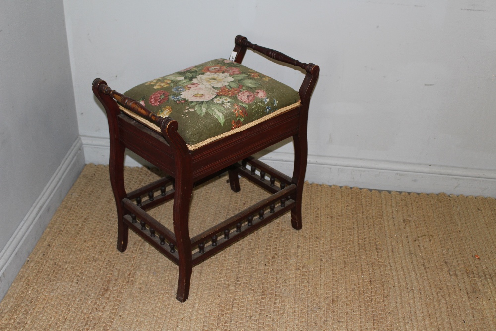 A late Victorian mahogany piano stool, the cushioned hinged seat between scrolled out and spindle - Image 2 of 3