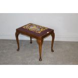 A mahogany dressing stool, with padded needlework seat and cabriole legs 46cm x 53cm x 39cm