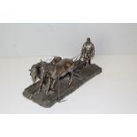 A bronzed resin ploughing group, 33cm long x 16cm high small defect in the manufacture to plough,