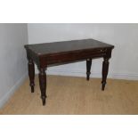 A Victorian mahogany serving table the rectangular top above reeded rails and turned legs 77cm x