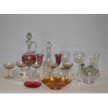 A selection of mixed glass wares, including tined decanter, brandy bells, orange tinted glasses,