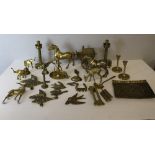 A large quantity of various brass wares, including candlesticks, brass flying ducks, swallows, brass