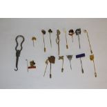 A selection of various gilt and white metal tie pins, including Horse shoe and crop terminal,