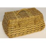 A woven-wicker picnic hamper, of tapered form with hinged cover. In good condition.