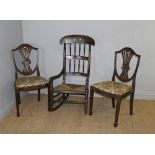 A 19th century stained-wood spindle backed rush-seated rocking chair 109cm sold along with two