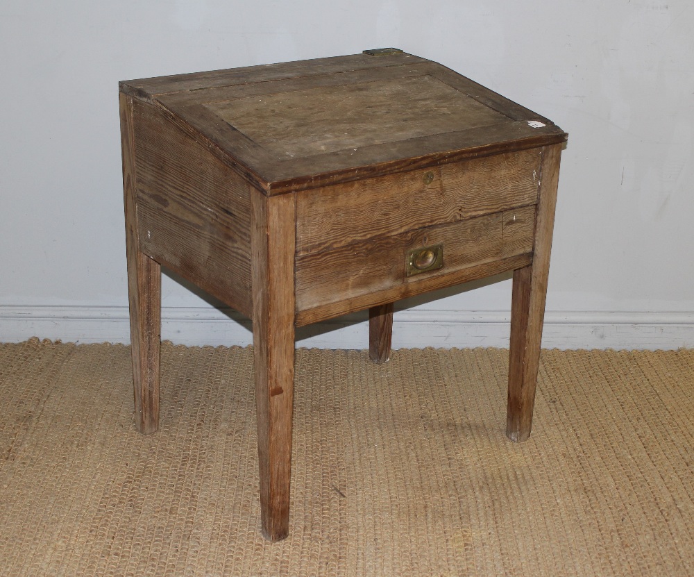 A Victorian pitch pine clerks desk, the top with attached brass 'Laurie' ink well