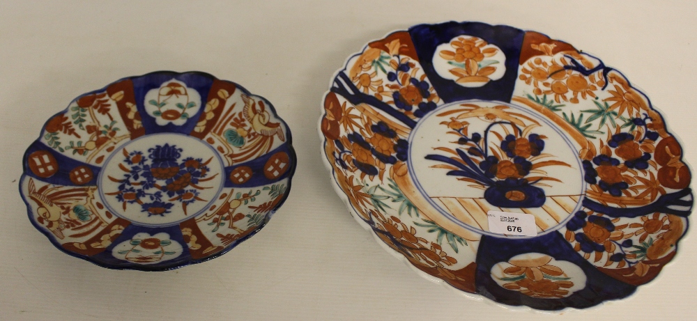 A Japanese Imari porcelain plate, decorated in the typical Imari style and palette 31cm together - Image 2 of 3