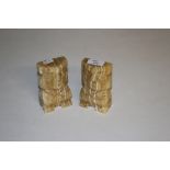 A pair of carved onyx bookends, carved as Inca style figures 12.5cm x 7cm some polished over