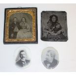 A 19th century Ambrotype photograph of a seated couple within a gilt metal slip and canvas covered