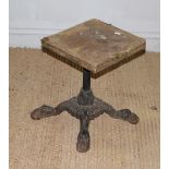 A cast-iron bar stool base with four feet, later top (af) 41cm a degree of corrosion but the base is