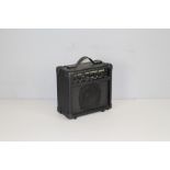 A Kingsman 10w Guitar Amplifier, with power lead 24cm x 24cm x 12.5cm