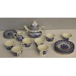 A Royal England blue and white pottery tea service, comprising a teapot, six cups (one AF) six