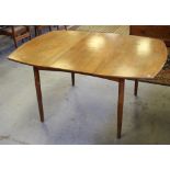 A 1960's/70's teak extending dining table, with bowed ends and cylindrical legs 72cm x 150cm (ext) x