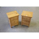 A pair of modern light oak and pine bedside chests, each with three drawers 62cm x 42cm x 36cm