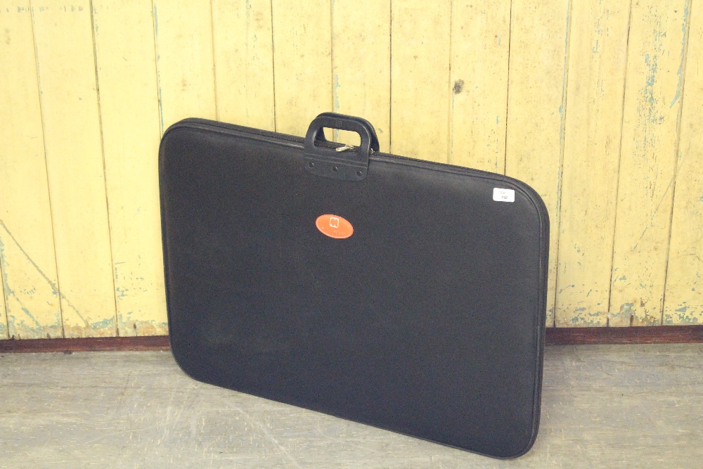A Portapuzzle folding jigsaw board, with zip closure and carrying handle, used condition