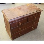 A Victorian stained-pine chest of drawers, with moulded top, two short and two long drawers with