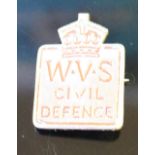 A W.V.S Civil Defence badge, by L.Simpson & C0, London 3cm, minor losses to red paint.