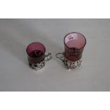 Two cranberry glasses with white metal & hallmarked silver holders, 65grams gross metal weight