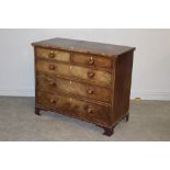 A George III mahogany chest of drawers, the rectangular strung top above two short and three long