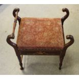 An Edwardian inlaid mahogany piano stool, with hinged padded seat between shaped supports and turned