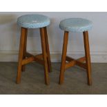 A pair of 1950's 'Cabot Woodware' stools, the padded circular seats with Atomic style design in