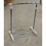 A modern chrome effect and white plastic clothes rail, in good used condition.