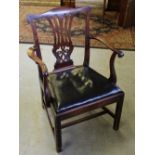 A Georgian mahogany open armchair, with yoke-form top-rail above a pierced vase-form splat and