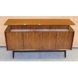 A 1960s EG E Gomme G-Plan teak sideboard, with three drawers over double hinged cupboard doors, on