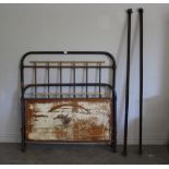 A Victorian brass and iron single bed, the footboard with grained metal panel 132cm x 125cm