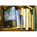 A box of gardening and horticulture books.