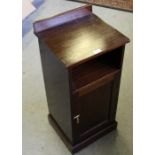 A early 20th century mahogany pot cupboard, with shallow raised back and panelled door 82.5cm x 37.