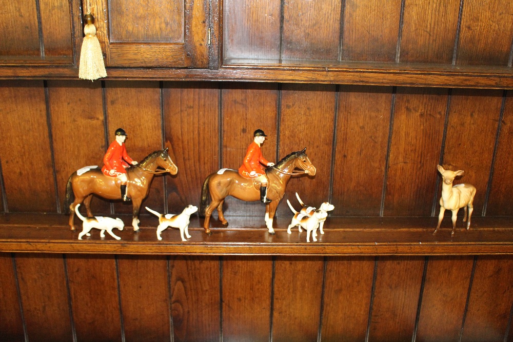 Two Beswick pottery huntsmen (one modern), four Beswick hounds, and a Beswick deer, all in good