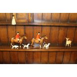 Two Beswick pottery huntsmen (one modern), four Beswick hounds, and a Beswick deer, all in good