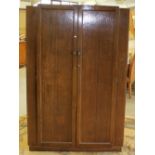 A 1940's oak double wardrobe, the interior with later shelving 185cm x 123cm x 56cm later shelving