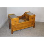 A 1930's oak dressing table, lacking mirror and supports 64cm x 97cm x 41cm wear throughout but