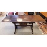 An Ercol elm draw leaf refectory table, 175cm x 71cm x 74cm high