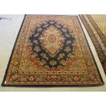 A modern machine made rug of Tabriz design, 228cm x 161cm generally good, requires a good old