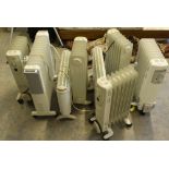 A group of eight electric and oil filled radiators, used but good condition.