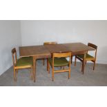 A 1970's Danish (?) teak extending dining table 74cm x 199cm (ext) x 78.5cm and four chairs 76cm