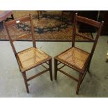 A pair of Edwardian inlaid and cane-seated bedroom chairs, of traditional form 87cm used condition.