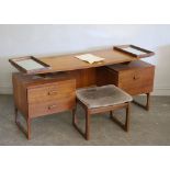 An EG G-Plan teak dressing table with floating top, drawers and foot stool 59cm x 152.5cm x 47cm &