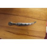 An Iraqi white metal and Niello work paper knife, in the form of a Jimbaya style dagger with