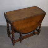 An oak barley-twist gate-leg table 73cm x 90cm x 42cm marks and scratches otherwise good.