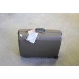 A Samsonite hard shell suitcase with combination lock, used condition.
