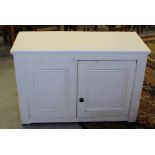 A 19th century painted-pine two door cupboard 83cm x 120cm x 51cm the top with applied white vinyl