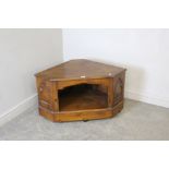 A modern stained-pine television cabinet, with Gothic influenced design 54cm x 98cm x 58cm marks and