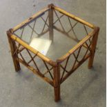 A square glass-topped bamboo coffee table 45cm x 51cm used condition with marks etc.