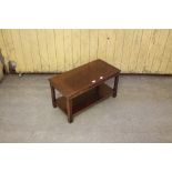 A mahogany coffee table with moulded top and reeded legs 42cm x 77cm x 38.5cm minor marks and