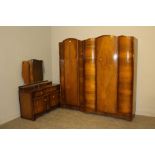 A two-piece figured walnut bedroom suite, comprising a single door wardrobe and dressing table,