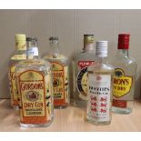 Three old 70cl bottles Gordon's Dry Gin (all imported, two with metal closures being Navy issue -